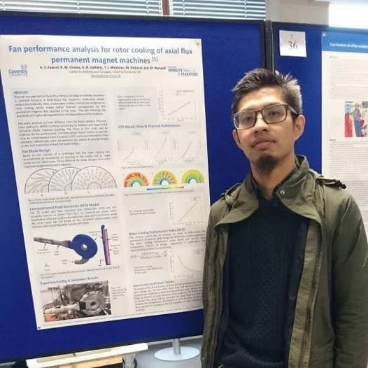 Dr Aid Fawzal bergambar di hadapan poster kajian kejuruteraan CFD di universiti United Kingdom